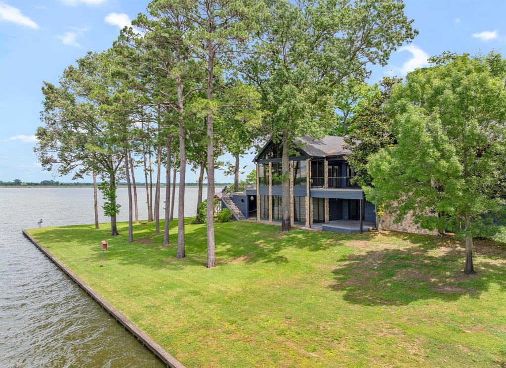 Luxury Lakefront Estate on Lake Cypress Springs – 6.5 Acres with 632’ Waterfront - 4 bedrooms with potential for 3 additional bedrooms!

Discover unparalleled luxury and privacy in this completely remodeled 6,124 sq. ft. lakefront estate on the pristine shores of Lake Cypress Springs. Nestled on 6.5 acres with 632 feet of waterfront, this stunning property offers breathtaking views, top-tier amenities, and an entertainer’s dream layout.

Property Features:
 • 4 Bedrooms (up to 7) with 5.5 Bathrooms – Spacious en-suite bedrooms with high-end finishes
        •       Private Gated Entrance
 • State-of-the-Art Movie Room – Enjoy a cinematic experience from the comfort of home
 • Panic Room – Securely designed for peace of mind
 • Expansive Walk-In Closet Room – A dream space for storage and organization
 • Custom Brand New Boathouse – Direct access to the lake for boating, fishing, and water sports with private boat ramp
 • 3128 sq. ft. Metal Building – Ideal for additional storage, a workshop, or recreational space or even to convert into a guest house has plumbing

Outdoor & Location Highlights:
 • 632 Feet of Private Waterfront – Unmatched lakefront views and access with a private boat ramp for water toys
 • 6.5 Acres of Beautifully Landscaped Grounds – A private retreat with mature trees and open spaces
 • Lake Cypress Springs – One of Texas’ most sought-after lake destinations

Home has 3 bonus rooms that can be converted to bedrooms: downstairs office, downstairs exercise room (with extra room off it that can be a closet) and upstairs library. 

This extraordinary lakefront home is a rare opportunity to own a fully renovated, high-end retreat with unmatched privacy, modern conveniences, and direct access to one of Texas’ most beautiful lakes.