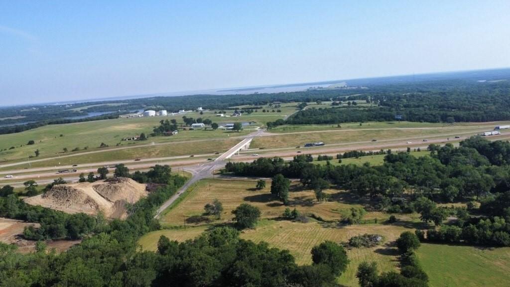 Prime 8.8acre development opportunity in Denison’s fastest-growing corridor along US Highway 75. This development-ready site offers city water, sewer, and electric already on site, along with valuable agricultural zoning and a current ag exemption that keeps taxes low during the planning phase. Included is a spacious 3,150 sq ft, 3bed 3bath home built in 2007, which serves as an ideal office, sales center, event venue, or temporary housing while development plans move forward. Just 13 minutes from the 7 billion Preston Harbor master planned development and the upcoming Margaritaville Resort groundbreaking targeted for 2027, the property sits in the direct path of progress. Adjacent self-storage and retail projects are already breaking ground, new single-family communities are rising nearby, and additional mixed-use projects along US 75 featuring restaurants, housing, and retail are adding significant traffic and demand. This versatile tract presents an outstanding opportunity for commercial retail, mixed-use development, hospitality, self-storage, or residential projects. Priced at a motivated $1,200,000 with owner financing available, this represents exceptional value at approximately $136,500 per acre in one of North Texas’ strongest emerging markets.