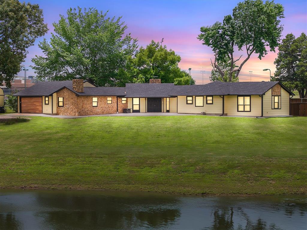 Tucked away on approximately 5 acres right in the heart of Grand Saline sits one of the most unexpected properties on the market. This 3 bedroom, 2.5 bath home offers the kind of setting that’s hard to find… a private pond, huge scattered trees, wide open green space, and room to breathe while still being just minutes from downtown, Hwy 80, and walking distance to all school campuses.

Inside, the home is full of character with massive wood beams, stone fireplaces, oversized living spaces, and views of the water from multiple areas of the property. The layout offers flexibility for everyday living, entertaining, or simply enjoying the peaceful setting.

Over the last several years, the sellers have completed extensive updates including two new 16-ton HVAC systems, new interior and exterior paint, updated electrical and wiring, thermoregulated windows, new gutter and French drain systems, concrete driveway and patio work, refurbished wood cabinetry, shower conversion, flooring updates, and more. The property also includes a pond aerator system, mature trees and landscaping, fruit and nut trees, and a long list of thoughtful improvements that reflect the care and investment that have gone into maintaining the home.

The deep private pond creates a beautiful focal point for the property, and the land sits above the renowned Carrizo-Wilcox Aquifer. For those needing accessibility to larger metro areas, the property is also conveniently commutable to the Dallas-Fort Worth area while still offering the peace and privacy of East Texas living.

Properties with acreage, water, and this much privacy inside city limits rarely come available in Grand Saline. This is the kind of property people drive by and wonder about for years, and it finally has a for sale sign in the yard. Schedule your private showing and come experience it for yourself.