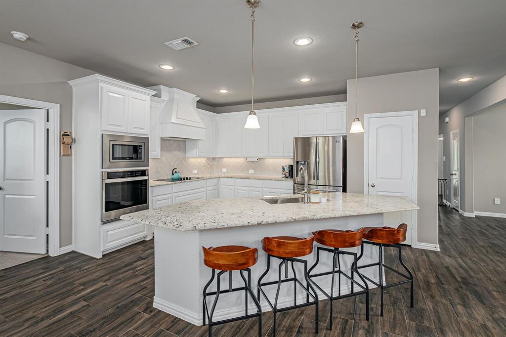 Seller is offering $16,000 towards closing costs or as a credit to fund a 2:1 rate buy-down! Reduce your mortgage payment significantly for the first two years. Bonus: If rates drop and you refinance early, any unused seller funds aren't lost—they are applied directly to reduce your principal balance! Enjoy lower payments today with built-in refinance protection for tomorrow. Subject to buyer loan approval.   

Drive-up to a spacious, manicured yard complete with a sprinkler system, chalk-stone flower beds, board-and-batten siding accents with shutters, and a welcoming covered porch perfect for morning coffee. This home was built for energy efficiency, including spray foam insulation, high SEER HVAC, and Low E windows. 

Step inside this Kingsbridge classic open-concept floorplan designed for comfort and modern living, with luxury tile and finishes. The home includes brushed nickel fixtures, arch-colonial entryways, LED recessed can lighting, a study with French doors, Formal Dining Room and a Kitchen boasting white cabinets, stainless steel appliances, custom range hood, granite counters, glazed porcelain herringbone-pattern backsplash, undercabinet lighting, an Island with pendant lights and breakfast bar. 

The spacious 1st level Primary Suite bath features granite, split vanities, a frameless walk-in shower, and garden tub and large walk-in closet. Upstairs, is the 2nd Primary Suite with a vaulted ceiling and ensuite bath, and two large bedrooms, one having an ensuite bath. 

The backyard has nice covered porch and backs up to farmland for privacy and tranquility. Country living paired with modern convenience, minutes from shopping, dining, and Summer fun at Lake Lavon!