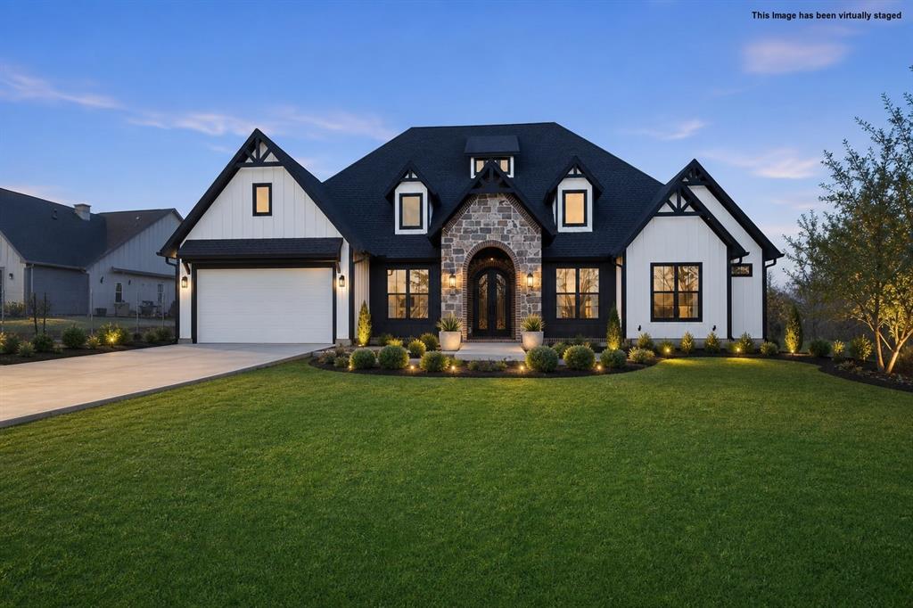 Welcome to a home where luxury meets the tranquility of country living. This exceptional custom-built residence has been thoughtfully designed with timeless elegance, modern conveniences, and everyday comfort in mind. Offering four spacious bedrooms, each with its own private en-suite bathroom, this home provides the perfect balance of comfort and privacy for family and guests. Soaring 12+ foot ceilings and an open, light-filled floor plan create a bright, inviting atmosphere that is ideal for both entertaining and everyday living. The luxurious primary suite is a private retreat, featuring a generous walk-in closet complete with custom built-in drawers for effortless organization. A dedicated office provides the perfect space for working from home, studying, or managing daily tasks. Designed to impress, the chef's kitchen is the heart of the home, showcasing a gas cooktop that can easily be converted to electric, an oversized butler's pantry with exceptional storage, and a charming coffee bar that makes every morning feel special. The spacious living room is anchored by a sleek electric fireplace that can also be converted to gas, offering both style and flexibility. Step outside and experience the best of outdoor living. The built-in grill creates the perfect setting for hosting family gatherings, weekend cookouts, or relaxing evenings while enjoying the peaceful country surroundings. Completing this remarkable home is a well appointed garage equipped with an electric vehicle charging station, reflecting the home's thoughtful design and modern amenities. Every detail of this one of a kind custom home has been carefully crafted to offer comfort, sophistication, and lasting memories. Don't miss the opportunity to make this extraordinary property your forever home.