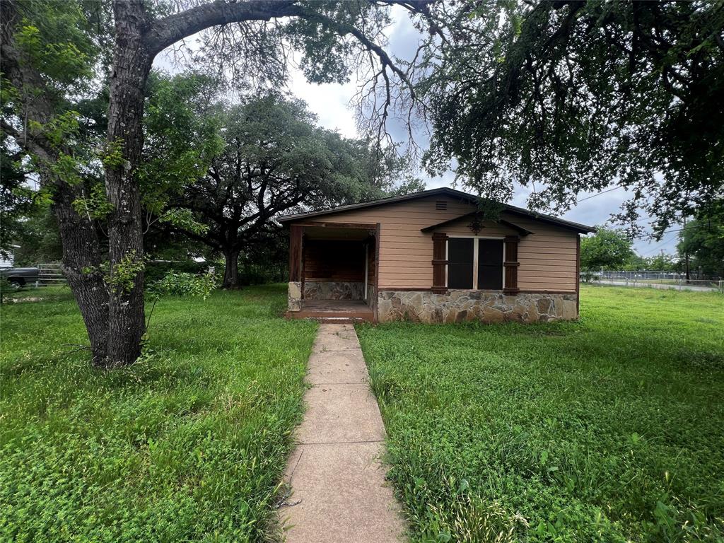 Opportunity meets potential on this spacious corner lot! This two-bedroom, one-bathroom home sits on a large, fully fenced property shaded by mature trees that provide both beauty and privacy. The expansive lot offers plenty of room to enjoy outdoor living, entertain, or expand. A standout feature is the large detached garage—perfect for a workshop, extra storage, or hobby space. Inside, the home offers a functional layout with solid structure, making it an excellent canvas for your vision. Whether you’re looking for your next investment, a project to customize, or a place to create something truly special, this property is full of possibilities.