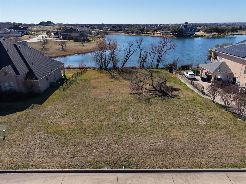 Discover the potential of 307 Golden Pond Drive, Cedar Hill, TX 75104 — a rare 0.505-acre waterfront lot nestled in a serene and established neighborhood. This unimproved land offers a peaceful setting with direct access to water, perfect for building your dream home or retreat. With ample space and scenic views, it's an ideal canvas for custom development in a prime location near nature and city conveniences.
Tranquill. Serenity. Lifestyle. BUILD YOUR DERAM HOME HERE!!! This Upscale residential lot offers a half acre of land surrounded by beautiful luxury Homes, Direct access to fish stocked lake, Rolling Terrain, Trails, Parks and Community Ponds. Enjoy Quiet living on a low travelled street that bestows ample space between neighbors creating an illusion of a country living feel. Experience some of the most amazing & beautiful SUNSETS right from your backyard. Bring your own BUILDER, Bring your own PLANS & turn your VISION INTO REALITY !!! Minutes away from Highway 67, 287 & 360.