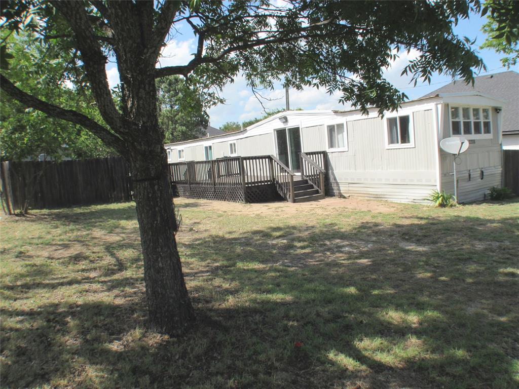 COZY AND CUTE, this home will serve you and yours for as long as you want! It will also make a great investment property as it lends itself to myriad situations and needs. Perimeter wood fence but with a metal white wrought iron fence at the road. Greeted by nice trees and a hardwood deck, you'll enter from the deck end. Nice neighbors will make you feel right at home immediately. Inside, one bedroom is to the right, the other all the way to the left. The bathroom is just off the hallway from the kitchen and living area, so it is perfect for roommate situations as well. Kitchen has TONS of storage space AND a separate island with even MORE storage! Appliances will convey. The rear exit has stairs that lead down to the rear of the home, but the owners didn't use it much. Off the stairs at the other side of the deck you'll find a nice fenced yard and a large storage shed with lots of extras to customize your new home. Canyon Creek has a playground, pool, clubhouse, fishing docks and boat launches along with guarded entry gate and a covered community mailbox near the entrance. Lots of access to Lake Granbury if you want to boat or fish! From Canyon Creek, easy access to Pecan Plantation, Indian Harbor and, at 144, turn left to go to Glen Rose and right to go to Granbury! Either way it is about 8 miles! 
High Speed internet available here from United Coop or any others. Join one of the fastest growing communities in Granbury!
Pull down blinds throughout most of the main living area and front bedroom. Secluded enough to where light management is not a problem. Few, if any, restrictions on this lot for future plans. Granbury schools pick up out here and guarded gate assures your family security! Most delivery services will also serve Canyon Creek. Lots of new construction going on out here, so you may want to buy this one while you wait and then rent it out when you move into your NEW home! See me about those, too! Welcome home to Canyon Creek! You'll like it here...