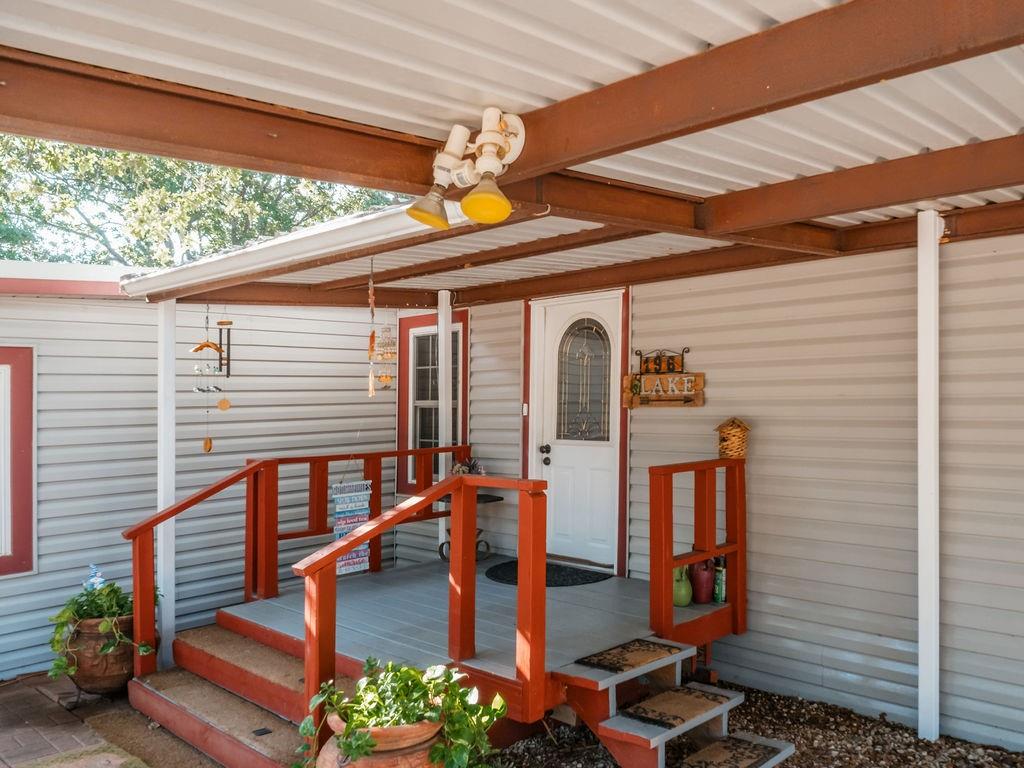 This inviting 4-bedroom, 2-bath home offers nearly 1,700 square feet of thoughtfully designed living space, just minutes from the shores of beautiful Amon Carter Lake, where boating, fishing, and lakeside fun become part of your everyday lifestyle. From the moment you arrive, this property draws you in with its versatility and comfort. Inside, you’ll find great-quality, double-pane windows that enhance energy efficiency and natural light, while the spray-insulated well house and recently replaced well pump provide peace of mind and long-term reliability. A water softener adds an extra layer of comfort to daily living. One of the standout features is the spacious enclosed outdoor flex space, perfect for a home office, workout room, playroom, or creative studio. Step beyond to your private backyard retreat, complete with a charming gazebo that sets the stage for entertaining guests, hosting family gatherings, or simply unwinding under the Texas sky. For those who love to travel or host, this property truly shines. Enjoy covered RV parking with a 50-amp RV hookup, an RV dump, making it ideal for extended family visits or weekend adventures. The septic system has been recently pumped, ensuring everything is move-in ready and well maintained. Blending indoor comfort with outdoor freedom, this home delivers a rare combination of location, functionality, and lifestyle, all just moments from the lake. Whether you’re seeking a full-time residence, weekend escape, or multi-purpose property, this one checks every box.
