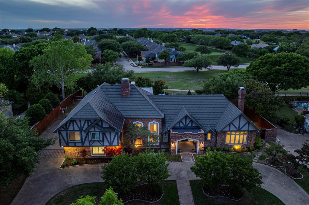 Rare find! One-of-a-kind Custom golf course home on a custom .48 acre lot in quiet Prestonwood Country Club Estates. This home features a roomy kitchen w island, breakfast bar, two sinks, 2 dishwashers, double ovens, gas cooktop stone countertops & state of the art appliances that opens into a family room with a stunning brick fireplace. Hardwoods throughout the main living areas. Master suite overlooks the pool & has an ensuite bonus room w FP that can be a sitting area or study.  Huge 1st floor game room w wet bar. Private backyard retreat includes a covered patio with stone FP & outdoor kitchen overlooking the pool, sand volleyball court & a secluded sunset patio w firepit. Private tennis court exclusive to the 13 homes in the neighborhood. 4 car garage and impressive front circular drive. Close GBT and DNT, Legacy West & the Arbor Hills Nature Preserve.