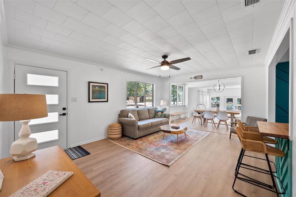 Please make appointment with Listing Agent to view. Must see in person! Remodeled 3 Bed, 2 Full Bath, dinning room and with large eat-in kitchen plus expansive entertainment game room with bar and great views all around! Wonderful partial water view from back yard, 1 minute walk to the community beach and boat launch is a huge plus! Located on the most gorgeous and peaceful lakeside neighborhood on Cedar Creek you will find! An adorable modern custom remodeled lake home at an affordable price. Home is built on a (.28AC) large LOT perched on grassy hill with partial water view with room to build a garage, a shed or add on to the house. Perfect home for full-time, 2nd home, or Short term rental ok in this community. MOVE-IN READY and furniture is negotiable. Cosmetic updates throughout entire home, plus newer AC unit 2022 and new gutters, remodeled kitchen, bathrooms, etc, too many modern custom updates to list. INCLUDED are stainless steel kitchen appliances and stacked washer and dryer. Voluntary HOA and NO MOBILES allowed here! Lot is surrounded by large trees in peaceful, serene neighborhood. Enjoy shaded covered back porch, a huge back yard, fire pit, huge mature trees, lake access, water views, a peaceful and safe neighborhood. SHOWN ONLY BY APPOINTMENT CONTACT LISTING AGENT FIRST. House sold on LOT 13 only, adjacent lot 12 is not listed but can be available for sale for additional cost to the right buyer. Please Do not approach home or walk around property without appointment. Property is video and audio monitored 24-7. Home also listed for lease MLS# 21291206.