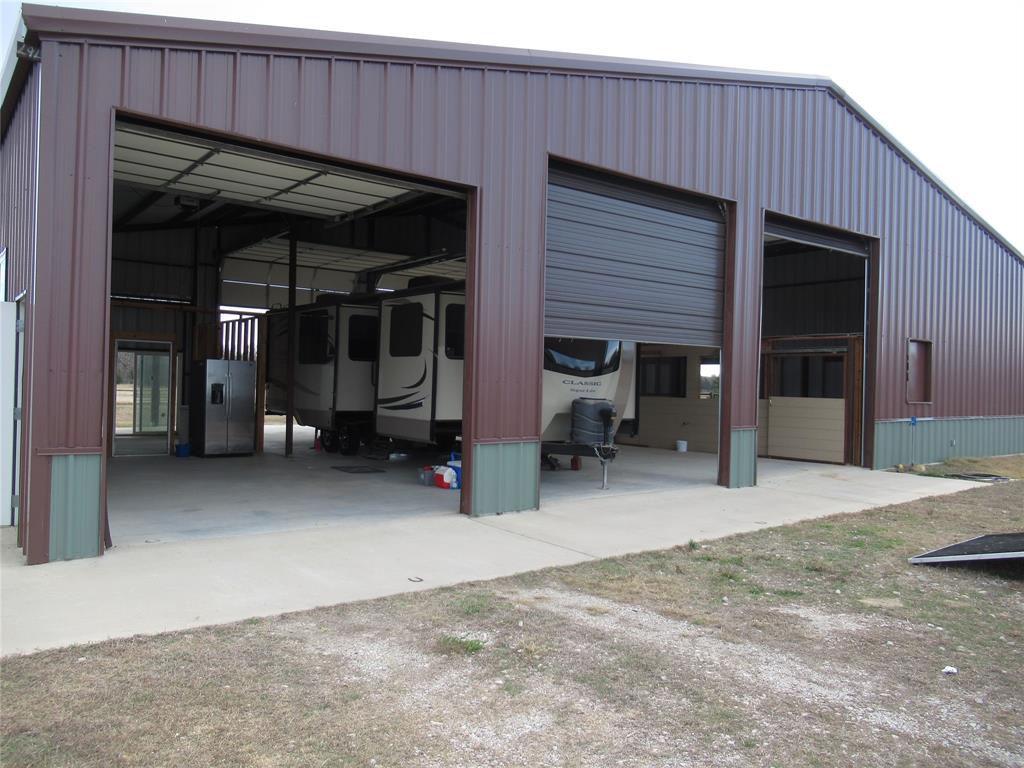 7483  CR 3223- 7.289 ACS. UNBELIEVABLE WHAT THIS PROPERTY HAS TO OFFER!  LARGE  SHOP TO RESIDE IN YOUR RV WHILE BUILDING YOUR HOME OR NEW MODULAR IS ALLOWED, ALL UTILITIES INSTALLED, SHOP HAS THREE 14 X 14 STABLES, WITH TURN OUT, TWO RV HOOKUPS, 4 WATER FAUCETS TWO INSIDE , TWO OUTSIDE WITH ONE BEING FROST FREE, TWO 200  AMPS FOR 2 RVS AND A HOME,FOUR ROLL UP 12 X 14 DOORS TWO ON FRONT & TWO ON THE BACK . BACK OF SHOP HAS A LARGE COVERED PORCH WITH PICTURESQUE VIEW  AND PRIVACY. TWO SEPARATE FULLY
FENCED PASTURES. NATURAL AND COASTAL BERMUDA GRASS . THERE  ARE  7 ACRES  IN AG USE FOR HAY PRODUCTION. FRONT PASTURE SMALL BALES, OTHER PASTURE BIG BALES. YOU WILL LIKE THE 40 FT SLIDING ENTRY GATE TO THE PROPERTY. LOCATED ACROSS FROM THE FLYING B
RANCH . LONE OAK ISD. DON'T WAIT MUST COME AND TAKE A LOOK!