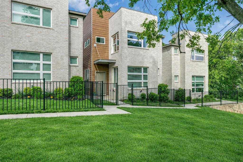 Modern design meets low-maintenance living in this beautifully maintained lock-and-leave home in the desirable Oakbend community. Featuring a striking contemporary façade with a blend of brick and wood, this residence offers a light-filled open floor plan with 3 bedrooms, 2.5 baths, plus a versatile loft or office space. The main living area showcases luxury vinyl flooring with the look of wood, soaring ceilings, and abundant natural light, flowing seamlessly into a well-appointed kitchen with granite countertops, stainless steel appliances, ample cabinetry, and a center island perfect for everyday living and entertaining. Large windows frame peaceful views of the surrounding green space, creating a serene backdrop throughout the home. Upstairs, the spacious primary suite offers tranquil treetop views, giving a treehouse-like feel, along with a well-appointed bath featuring dual vanities, soaking tub, and separate shower. Secondary bedrooms and flexible loft space provide room for guests, work, or play.
Enjoy a private, fenced yard ideal for pets and easy outdoor living. Additional highlights include custom window treatments, updated lighting with contemporary ceiling fans, energy-efficient systems including a newer water heater and upgraded HVAC, and a two-car garage. Ideally located with quick access to Highway 121, I-35, and DFW Airport, and just minutes from shopping and dining, including Costco, Target, and more. HOA includes exterior maintenance, landscaping, water, sewer, and trash for true low-maintenance living.