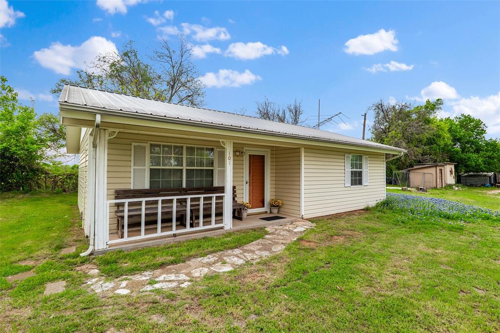 If you have ever desired to own a tiny home, out of town where you can enjoy quite like nowhere else, PLUS two additional lots adjacent, this is it! The property will total approximately .402 of an acre. Buyer will be responsible for new survey. This home is in a community surrounded on three sides, as a Horseshoe does, by the Brazos River. This is an opportunity to have access to tooling down the river in your canoe or fishing all day. The river is a short distance from the house and is accessible through a gate at the end of Iroquois Trail. Also, Horseshoe Bend has a club house, golf course, a small grocery store with a grill, a church and an airport. All the household furnishings are included as are the two additional lots to the north of the house. You've got a covered paved area to park your car or sit on the bench swing and wile away the hours. The home is pale yellow with white trim! How precious is that?! The long front porch is covered and has an old church bench for your sitting pleasure. This property must be seen to be appreciated. The original owner built this home himself, using top notch construction techniques such as 2x6 studs.  Make an appointment today! At this price, it's too good to miss out!