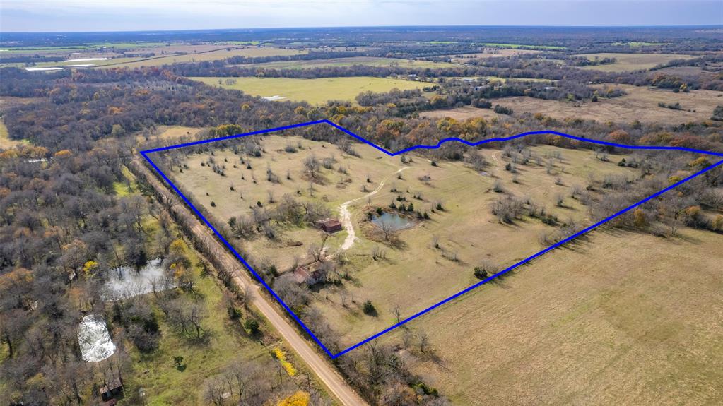 You can’t buy happiness, but you can buy dirt! Thinking about getting out of the city? This 35 acre property is a great place to build a home, get some livestock and live the country life! Great location, close to the new Bois D Arc Lake! With approx 1700 feet of road frontage, this would provide plenty of room to build at multiple locations! Old house and barn on property. Pond for fishing. Water meter in place. No known restrictions. Ag exempt.
