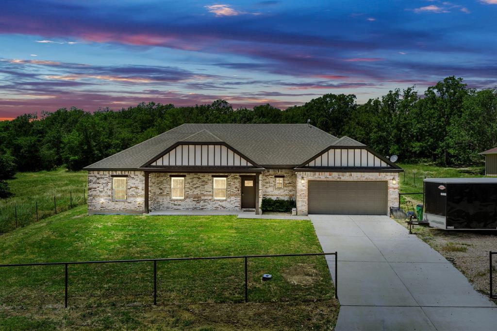 This 3-bedroom, 2-bath home offers an open floor plan situated on approximately half an acre near Lake Tawakoni. The layout provides flexible living and entertaining space with a seamless flow between the main living, dining, and kitchen areas. Enjoy the balance of convenient access to Dallas and the relaxed setting of country surroundings. Located just steps from the lake, this property offers opportunities for outdoor recreation, weekend getaways, or full-time living with extra space to enjoy.