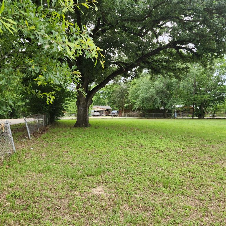 Beautiful corner lot with trees and established yard. Utilities are installed and ready to go, streets are paved and this location is perfect your new site-built home or mobile home. The lot is conveniently located within walking distance of shopping and restaurants, Cedar Creek Lake is a block away where you can enjoy beautiful views, boating or fishing.  This lot can be purchase separately but there are 3 other lots available also.