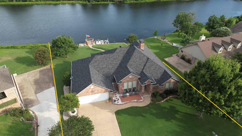 The location of the gorgeous waterfront property could not be more perfect…located in the charming East Texas town of Mineola.  The afternoon sunsets overlooking the lake are just spectacular!  You will be drawn to the wall of windows overlooking the lake and stunning stone teared flower beds with walkway that leads to the fishing pier and boat slip.  This home has a wonderful floor plan with open concept living, split bedrooms, large sunroom, good size office with private entrance and deck.  The custom home was designed with a lot of details from the beautiful trim work throughout to all the storage cabinets and closets.  The garage easily accommodates a full-size truck and a 270 sq ft attached basement perfect for a workshop or garden shed.  Spring Lake is fully stocked and maintained by the HOA.  Located in the heart of Mineola with a historic downtown that hosts so many small-town events, full of unique shops, antique stores, restaurants and only a few miles to the nature reserve.