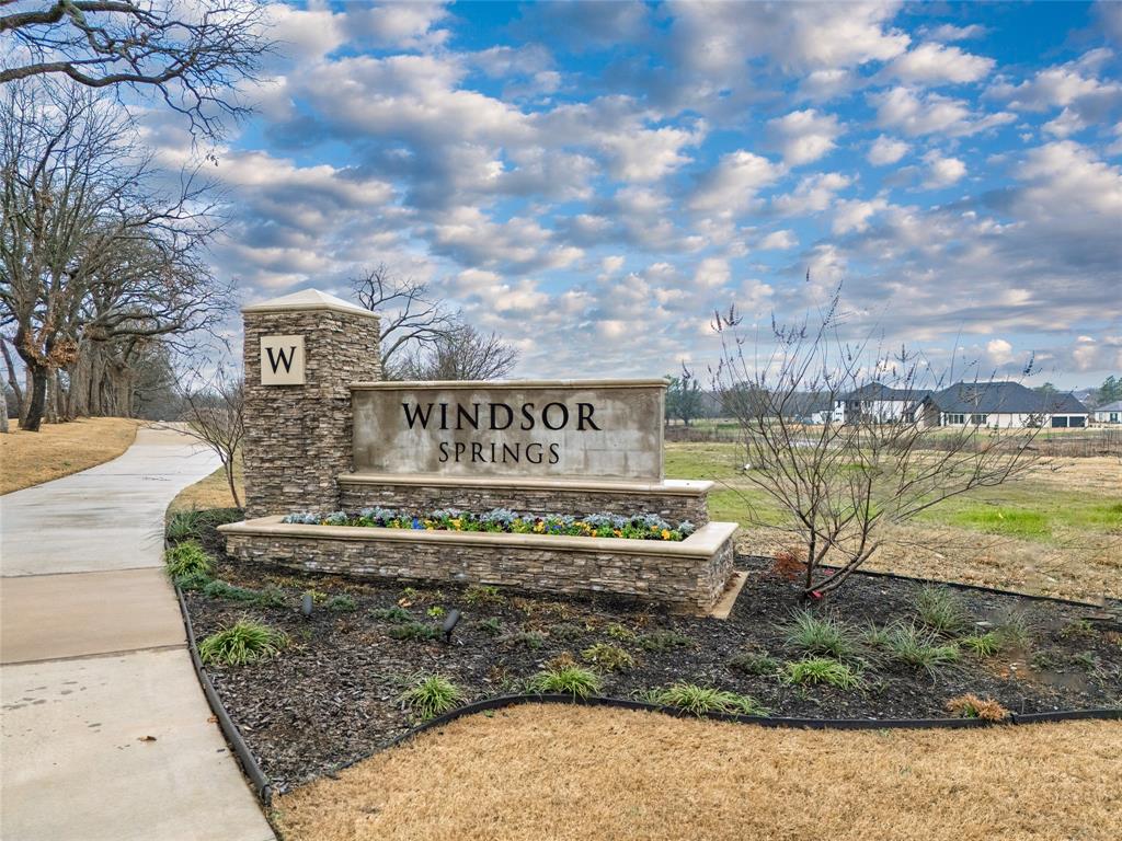 Exceptional opportunity to own land in the Dallas-Fort Worth area. 3.037 Acres! Beautiful 3-Acre Home-site with Pond in Windsor Springs — A premier luxury home community located near the serene shores of Lake Lewisville. Design and build your dream home on this spacious home-site, offering the perfect combination of upscale living and natural beauty. The property's desirable location near Lake Lewisville creates a stunning backdrop for your future residence while providing convenient access to everything the Dallas-Fort Worth Metroplex has to offer.

The front portion of the home-site is ready for construction and overlooks a scenic pond, while the heavily wooded rear section provides privacy and picturesque views. Electricity and city water are already available on-site. Homeowners may choose from respected community builders such as Toll Brothers and Drees Custom Homes, or bring their own custom builder to create a residence tailored to their vision and lifestyle.

Located just minutes from Highway 380, this property offers easy access to premier dining, shopping, and entertainment destinations. Windsor Springs is known for its lush green spaces, mature trees, and community pond with a fishing pier, making it an ideal setting for those who value quality amenities and a peaceful atmosphere.

Surrounded by beautiful green space and conveniently located near several country clubs, this home-site offers more than just a place to build—it provides the opportunity to create a private retreat in one of the area's most desirable and sought-after communities.