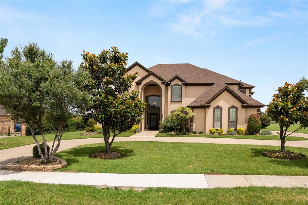 Set on a sprawling 1-acre cul-de-sac lot, this exceptional home is designed with family living in mind, offering an incredible amount of space, comfort, and flexibility for multigenerational households. Featuring 7 bedrooms, 6 full baths, and 1 half bath, the thoughtfully designed layout includes 4 bedrooms and 3 baths on the main level, making it ideal for extended family, guests, or private in-law accommodations. Upstairs, you’ll find 3 additional bedrooms and 3.5 baths, providing everyone their own space and privacy. Multiple living areas create the perfect environment for gathering and making memories, highlighted by a beautiful see-through fireplace that connects two main living spaces. Rich woodwork, crown molding, and abundant built-ins add warmth, character, and functionality throughout the home. A spacious game room and dedicated media room ensure there’s something for everyone—whether it’s movie nights, playtime, or hosting family celebrations. The primary suite offers a true retreat, complete with a cozy sitting area, wet bar, and private access to a large balcony—perfect for quiet moments to unwind. A rare dual primary suite design provides added flexibility for multigenerational living or long-term guests. Outside, the expansive lot offers endless opportunities for outdoor enjoyment, from kids playing to hosting gatherings. The circular driveway and 3-car garage provide ample parking for family and visitors alike, all set within a quiet cul-de-sac for added privacy and peace of mind.With a newer roof and HVAC systems (all less than three years old), this home combines thoughtful updates with timeless comfort. Spacious, inviting, and incredibly versatile, this is a place where families can truly grow, gather, and thrive together.