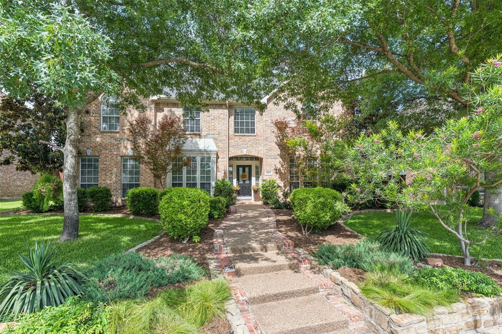 Beautifully landscaped and ideally located in sought-after Sharps Farm in NE Richardson, this stunning home offers the perfect blend of elegance, comfort, and convenience — all within exemplary Plano ISD and just minutes from Hwy 190. Step inside to discover gorgeous hand-scraped hardwood floors throughout the downstairs. A formal dining room with decorative lighting welcomes you on the left, while a private office with French doors sits to the right, ideal for working from home. The spacious living room features soaring ceilings, built-ins, a cozy gas fireplace, and expansive views of the backyard oasis, seamlessly flowing into the kitchen and breakfast area. The kitchen is designed for both everyday living and entertaining, complete with Corian countertops, double ovens, an electric cooktop, abundant cabinetry, and an oversized island. The downstairs primary suite is a true retreat with hand-scraped hardwood floors, backyard views, and plenty of room for a sitting area. The primary bath offers a jetted tub, double vanities, separate shower, and a dedicated vanity space for getting ready. A secondary bedroom and full bath downstairs provide flexibility for guests or multigenerational living. Upstairs, you’ll find three additional bedrooms, two full bathrooms, and a large game room perfect for movie nights, play space, or entertaining. The backyard is truly exceptional — featuring a sparkling PebbleTec-finish pool with waterfall, relaxing spa, and a covered patio with solar shades designed for year-round enjoyment and entertaining. With beautiful curb appeal, spacious living areas, and an unbeatable location close to shopping, dining, and major commuting routes, this home offers everything you’ve been looking for in one of Richardson’s most desirable neighborhoods.