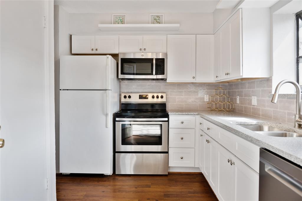This impeccably maintained first floor 1-bdrm,1 bath condo is nestled in the community of Bent Tree Forest condos.Take advantage of this excellent location and the amenities the community offers including sparkling swimming pool,tennis courts and clubhouse.Close to the Galleria & Addison where shopping,dining and entertainment are endless.This home boasts stainless steel appliances, granite countertops garden window & goose neck faucet in kitchen, faux wood blinds, living areas adorned with vinyl wood look flooring and tile throughout,cozy living space with stunning wood burning stone fireplace, spacious bedroom with walk in closet, separate dining room with easy access just off the kitchen a great space for entertaining family and friends. Step outside and discover your private oasis with a fenced in covered patio for relaxation and an extra storage closet. 1 assigned covered parking spot included. Refrigerator, Washer & Dryer will convey to new home owner!Make your appointment today!