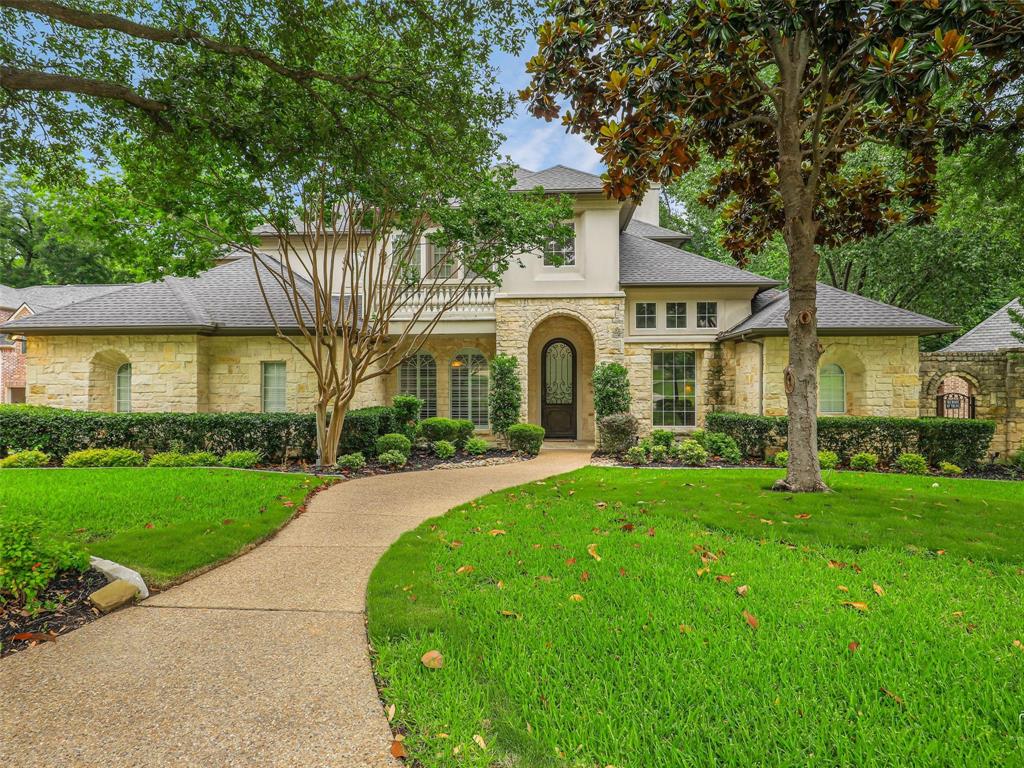 Exceptional custom estate tucked away on a quiet cul-de-sac beneath towering trees and surrounded by a breathtaking park-like setting. From the moment you arrive, the impressive iron clad front door sets the tone for the elegance and craftsmanship found throughout. Inside, dramatic two-story windows flood the home with natural light, highlighting the sophisticated open-concept design. Formal living and dining areas feature soaring ceilings, a stunning wall of windows, an elegant staircase, and wine storage accented by a wrought iron door — creating an unforgettable space for entertaining. The thoughtfully designed floor plan offers both privacy and comfort, including a secluded study and a luxurious split primary suite with spa-inspired bath and adjoining golf simulator room. A secondary bedroom enjoys tranquil pool views and convenient bath access. Upstairs you will find secondary bedrooms with a jack and jill bath, as well as a third bedroom with ensuite bath. Balcony off game room offer a place to meditate, and a media room creates space to relax and watch your favorite movie. At the heart of the home, the chef’s kitchen is beautifully appointed with rich light wood cabinetry, built-in refrigerator, double ovens, oversized island, and expansive walk-in pantry. The casual dining area and inviting family room with fireplace overlook the resort-style backyard, where stone steps lead to the sparkling pool and separate spa nestled among mature trees. Additional amenities include a spacious utility room with bench storage and a desirable split three-car garage configuration, including one oversized bay with a five-panel door. Every detail of this remarkable home blends timeless elegance with everyday functionality in a truly
unforgettable setting. Refined luxury at its finest