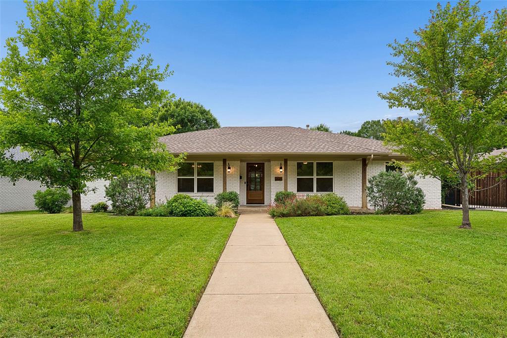 Beautifully reimagined and completely remodeled, this Lochwood home offers a seamless open-concept design paired with serene waterfront living. Hardwood floors flow throughout the main living areas, leading into a stunning island kitchen equipped with stainless steel appliances, quartz countertops, and a timeless marble backsplash. The inviting main living room is anchored by a cozy fireplace, creating the perfect gathering space, while a charming breakfast nook with a built-in storage bench adds both function and character. Just beyond, a fabulous family room showcases expansive views of the backyard and private pond, bringing the outdoors in.  The primary suite serves as a true retreat, featuring a double vanity, a generous walk-in closet, and an exquisite marble double-headed shower alongside a large soaking tub. Three additional generously sized bedrooms, plus a private office, offer flexibility for everyday living.  Set on an expansive one-third acre lot, the backyard is truly special, overlooking the tranquil water with its own dock—perfect for quiet mornings or evening unwinding. All of this on a peaceful, friendly street in one of East Dallas’s most sought-after neighborhoods.