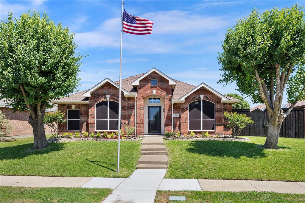 This move-in ready home has been recently updated throughout with luxury vinyl plank flooring, neutral paint, door hardware, baseboards and rocker light switches. It's oh-so-pretty with an open floor plan, high ceilings and interesting angles. The handsome office boasts a custom floating multi-station desk and shelving. The warm and inviting family room features a gas-log fireplace with custom surround and mantle. The light and bright kitchen is the heart of the home, with granite-look counters, breakfast bar, prep island, gas range and walk-in pantry with laundry connections. Trendy lighting defines the dining area that has a door leading to the covered patio. The spacious primary suite is split for privacy and showcases a tranquil renovated bath with a granite-topped vanity, dual sinks, mirrors, lighting, hardware, fixtures, custom built-in linen cabinet and oversized shower with a frameless glass enclosure, bench seat and pebble tile floor. The secondary bedrooms have ceiling fans and share a gorgeous bath that has been updated with a granite-topped vanity, mirror, lighting, fixtures and hardware. Bedroom 2 has a cool built-in loft style bed that can be removed by request. The backyard is ready for outdoor entertaining, its huge pergola-covered patio has string lights, ceiling fan and gas stub for your grill. Have a seat in the swing and you'll never want to leave! Other exterior amenities: extended-width driveway, insulated garage door, storm door, solar screens, gutters, sprinkler system and storage shed. Recent improvements: water heater (2024); HVAC system and ductwork (2019); roof (2018). Lofland Farms offers a pool, splash pad, kiddie pool, clubhouse, fenced playground and on-site elementary school. Rockwall-Heath's 9th Grade Campus and College and Career Academy are also within walking distance. Conveniently located near shopping (HEB, Costco, IKEA), restaurants, the Harbor District, historic downtown Rockwall, Lake Ray Hubbard and major highways.