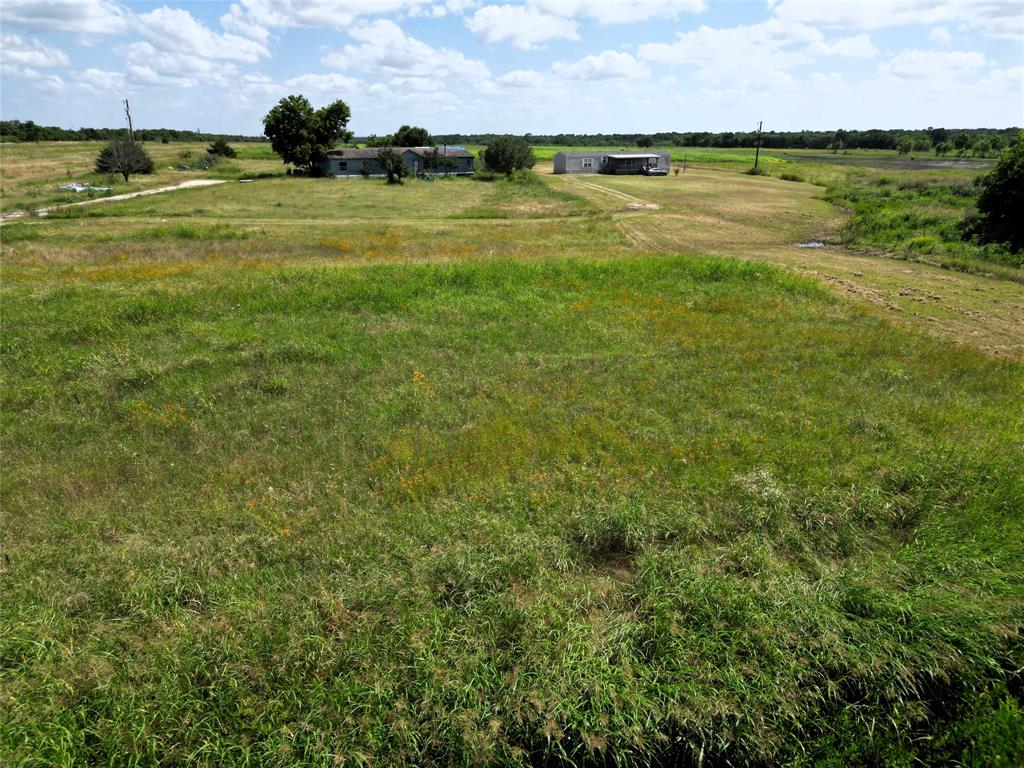 Discover 15 pristine acres located in highly desired Caddo Mills, offering a perfect blend of open space, convenience, and potential. With 13 acres currently in AG use, this property is ideal for farming, livestock, or keeping taxes low while you plan your future build. The land features a wide-open landscape with no trees, providing maximum flexibility for homesites, barns, or pastures. A small creek gently crosses the front corner of the property, adding a touch of character without impacting usability and no floodplain. Located in a fast-growing area with easy access to major highways, this is an excellent opportunity to own acreage in a sought-after part of Hunt County. Bring your plans and make this beautiful property your own.