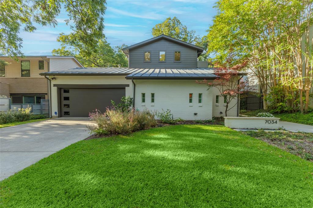 Lakewood 4 bedroom soft Contemporary home with 3 living areas and teardrop pool. The open living and dining areas feature 11’ floor-to ceiling windows and brick fireplace. The open kitchen has Wolf 6-burner range and breakfast bar. The 1st-floor master suite is private and serene, and the en suite bath has dual vanities, jetted tub, separate shower and walk in closet. The first floor also has laundry room, mud area and half bath. The second floor has two large secondary bedrooms that share a full bath, and the home’s 3rd living area.The outdoors feature both a peaceful side courtyard, and tree-canopied backyard oasis with teardrop pool and covered patio. The home is stunning and must be seen to appreciate
