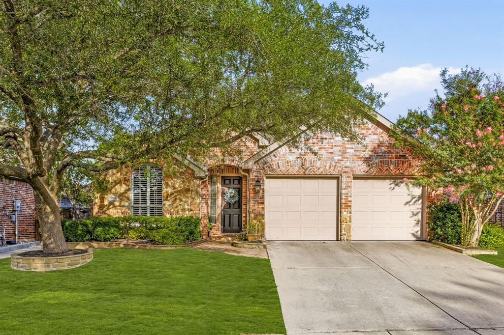 Welcome to this beautifully maintained home in the highly sought after Stonebridge Ranch community, where timeless design, comfortable living, and exceptional amenities come together. Offering 4 bedrooms, 3 full baths, and 2,338 square feet, this thoughtfully designed home showcases beautiful hardwood flooring and tile throughout, elegant finishes, and a versatile floor plan. Upon entry, a dining room with plantation shutters creates an inviting space for gatherings. The well appointed kitchen features granite countertops, a center island, gas cooktop, abundant cabinetry, and a bright breakfast area. Open to the kitchen, the warm and welcoming living room is highlighted by a striking floor to ceiling stone fireplace, built in surround sound, and direct access to the covered patio, creating seamless indoor outdoor living. The private primary suite offers a relaxing retreat with a charming bay window and a spacious ensuite bath complete with dual vanities, soaking tub, walk in shower, and generous walk in closet. Two additional bedrooms and a full bath with dual sinks are conveniently located on the main level, while the upstairs features a versatile flex space ideal as a game room or second living area, along with a fourth bedroom and full bath. Additional highlights include a 2 car garage with storage, a floored attic for exceptional additional storage, and thoughtful updates throughout. Outside, enjoy the covered patio overlooking a beautifully landscaped backyard shaded by mature trees. The home's mature landscaping and outstanding curb appeal create a welcoming first impression. Located within the award winning Stonebridge Ranch community, residents enjoy an unparalleled lifestyle with community pools, greenbelts, miles of trails, parks, playgrounds, courts, and numerous community events. Conveniently located near premier shopping, dining, golf, and top rated schools, this exceptional home offers the perfect blend of comfort, convenience, and community.