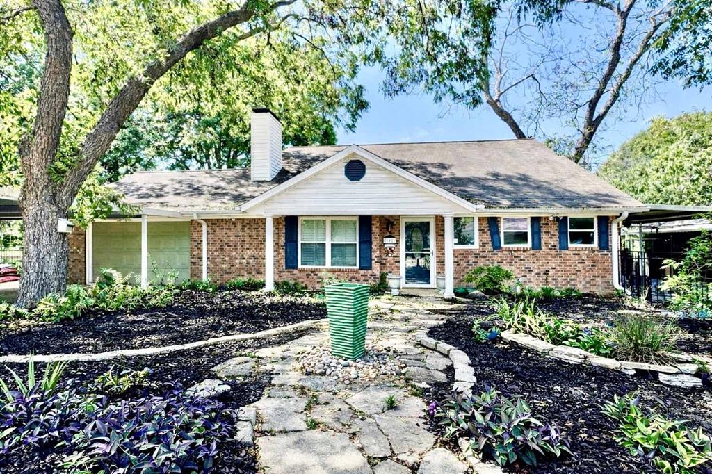 Welcome to this charming, tree-shaded retreat in the heart of Corsicana, where comfort, character, and outdoor living come together beautifully.  Nestled beneath mature trees on a spacious oversized lot, this inviting 2,100 square foot home offers a warm and welcoming layout.  This lovely home has been recently updated throughout with new paint, tile flooring, and stylish finishes.  There are 3 bedrooms, 2 full bathrooms, garage, a spacious living room with vaulted ceilings, a stunning brick wood-burning fireplace, a functional kitchen with abundant cabinet space and tile countertops, a sunroom looking out to the backyard and in-ground swimming pool for morning coffee and relaxation,  a huge backyard shaded with mature trees and established landscaping offering plenty of space for gardening, play, and entertaining, a potting room plus a large storage-workshop for hobbies and projects, covered carport, hot tub, sauna, covered patio, and much more!  Don't miss your opportunity to own this beautiful home with room to grow and relax.  Schedule a showing today!
