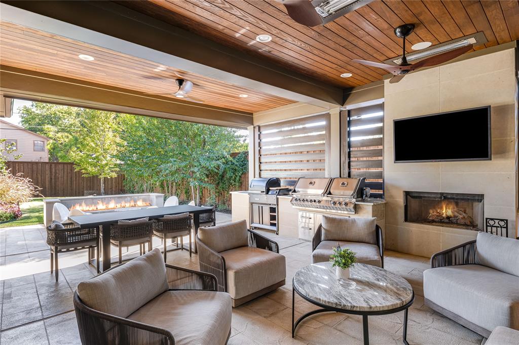 Situated on one of the most desirable blocks in the Bird Streets, this tree-lined street is surrounded primarily by newer homes and offers minimal through traffic thanks to its cul-de-sac–like setting. This exceptional custom residence is thoughtfully upgraded well beyond typical new construction. It delivers elevated everyday living with rich, warm finishes that define today’s most sought-after design trends. Completed in 2023, this home has a rare a 3 car garage, on an oversized 163’ deep lot, which allows for expansive backyard space with ample room for a future pool. The first floor flows effortlessly, through two sets of black iron double doors to an extended covered patio that is fully equipped with a built-in grilling station, ceiling heaters, fireplace, privacy wall, and a striking modern fire feature, delivering an experience that feels intimate yet welcoming. White oak wood floors, Hubbardton Forge and Restoration Hardware lighting, Fisher & Paykel appliances, and a Napoleon grill reflect the elevated level of craftsmanship and finish carried throughout the home. Additional enhancements include a fully climate-controlled wine room designed for approximately 300 bottles, thoughtfully integrated quartzite and custom stone detailing throughout key spaces of the home, and upgraded, high-performance HVAC systems offering a level of comfort and efficiency that surpasses standard new-build specifications. Over $30,000 in professionally added trees over the past two years create a setting that already feels established and mature. Upstairs, the expansive game room—currently designed as a golf simulator lounge—includes a bar with beverage fridge and access to a front balcony. An adjacent bonus room (not counted as a bedroom) offers flexible space ideal for a fitness studio, second study, or private mahjong room. Ideally located in one of Dallas’ fastest-growing neighborhoods, walkable to Inwood Village and just minutes from Love Field Airport.
