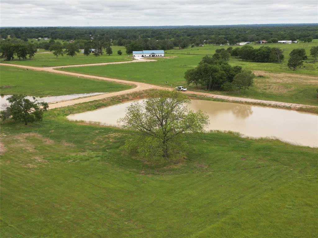 The pond is finished, and the Seller has begun stocking the bait populations. Come build your dream home on this stunning 2.98-acre lot and enjoy the incredible setting of a private pond with a massive native pecan tree in your back yard, just 75 miles east of Dallas. There are some restrictions, but no HOA. Homesites are restricted to 1,500 sq. ft. living minimum, site-built homes only. You are just 2 miles east of the world-renowned Lake Fork, 8 miles from the new SRA recreational facility that has 6 boat ramps, 8 miles to SRA waterpark. Just 17 miles from the charming town of Sulphur Springs, 35 miles to Canton First Monday Trade Days. Two golf courses within 10 miles will satisfy all players of all skill levels. Electric, water, fiber internet are available at the lot. Barndominiums are allowed with plan approval. Approved plat is available. Bring your own builders, or we can suggest a builder for you.
