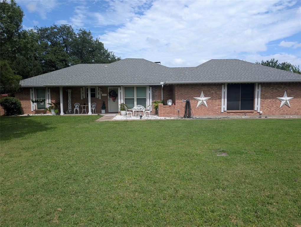 Enjoy country living with room to spread out on this charming property situated on **over half an acre outside the city limits** with **NO HOA** restrictions.

The main home features **3 bedrooms, 2 full bathrooms, and a 2-car garage**. Inside, you'll find a bright kitchen with white cabinetry, granite countertops, and a breakfast bar, perfect for casual dining and gathering with family and friends. The home offers a modern, neutral color palette with neutrals walls and gray laminate flooring throughout. The spacious living room features double doors leading to the backyard, creating a seamless connection between indoor and outdoor living.

Step outside to an L-shaped covered patio, an ideal space for relaxing, enjoying the outdoors, or entertaining guests year-round.

This property also includes several valuable bonus features, including an oversized detached garage or workshop equipped with window-unit air conditioning, a greenhouse, and a two-room tiny house with electricity and window-unit air conditioning, offering endless possibilities for a guest space, home office, hobby room, or studio.

With plenty of space, versatile outbuildings, and the freedom of living outside city limits, this unique property offers the perfect blend of comfort, functionality, and country charm. 

Seller will consider concessions with an acceptable offer.  Seller intends to have an ESTATE SALE.