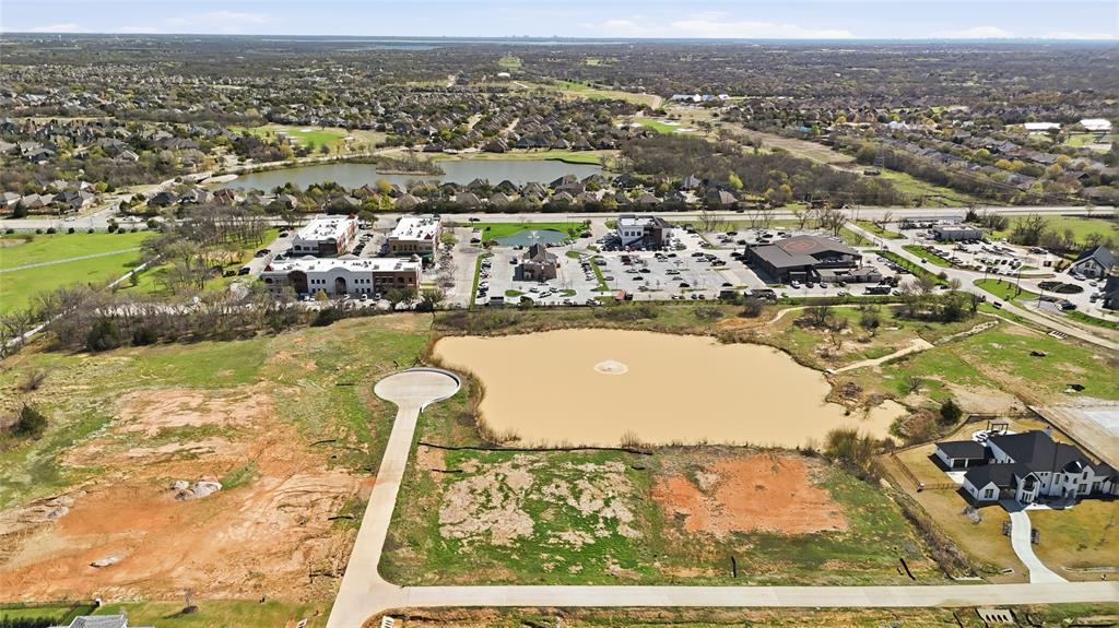 Build your dream estate on this exceptional 2-acre homesite at 2701 Romero Way in the desirable Hudson Hills community of Bartonville. This beautiful property features a private pond on the lot, creating a peaceful and scenic backdrop for a truly one-of-a-kind custom home. With generous space and natural beauty, the homesite offers endless possibilities for designing a luxury residence that blends indoor comfort with outdoor living.

Situated on a quiet interior lot, the property provides both privacy and picturesque water views—an increasingly rare feature in today’s market. Bring your own builder and take advantage of the flexibility to create a home tailored to your vision, whether that includes expansive outdoor entertaining spaces, a resort-style pool, or thoughtfully designed landscaping that enhances the pond setting.

Hudson Hills is an emerging luxury community in Bartonville featuring custom homes by some of North DFW’s premier luxury home builders. The neighborhood is quickly gaining attention for its spacious estate lots, beautiful architecture, and ideal location within one of the fastest-growing luxury real estate markets in the Dallas–Fort Worth Metroplex.

Enjoy the space and tranquility that comes with country-style living while remaining just minutes from everyday conveniences. The property is located near the vibrant Marty B’s entertainment district, offering dining, live music, and social gathering spaces just a short drive away. Nearby shopping, dining, and major commuting routes provide easy access to surrounding areas while preserving the peaceful atmosphere Bartonville is known for.

With its private pond, generous acreage, and prime location, this homesite presents a rare opportunity to build a custom luxury estate in one of North Texas’ most desirable communities.