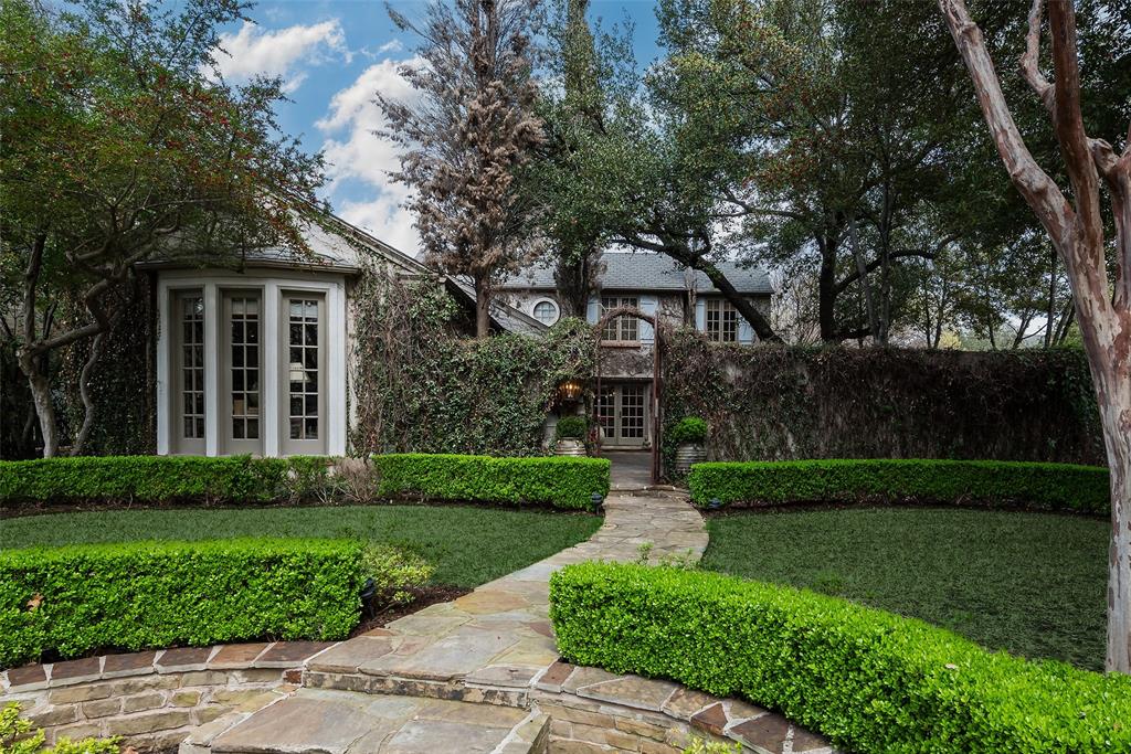 A beautiful courtyard provides a welcome entrance into this warm and inviting French traditional home, located on an over-sized 76x147 corner lot in the heart of Highland Park. Charm exudes from every room in this beautifully appointed home, with lovely hardwood floors, floor to ceiling windows, and a large kitchen with gourmet appliances.  The primary bedroom is located on the first floor, with separate bathrooms and closets, and there is an additional downstairs bedroom with an en-suite bath.  The second floor includes a beautiful bedroom and bath, and an additional bunk room. There are beautiful views from every room into the landscaped courtyards. Located in the heart of Highland Park and minutes from Highland Park Village and Bradfield Elementary, this special property is not to be missed!