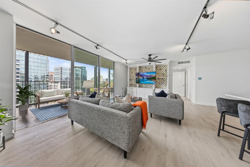 Perched on the 16th floor of one of Dallas's most prestigious high-rises, this stunning 1,813 sq. ft. residence delivers an unmatched blend of modern luxury, comfort, and convenience—set directly along the iconic Katy Trail. Remodeled in 2019, the home strikes a rare balance between sophisticated design and effortless livability.

Step inside to a light-filled, open layout enhanced by floor-to-ceiling windows that frame the space with warmth and air. Outdoor living takes center stage here, with three private balconies offering multiple vantage points to soak in the views, including an expansive 340 sq. ft. main balcony perfect for morning coffee or sunset gatherings.

The primary suite is a true sanctuary, featuring three walk-in closets—an extraordinary rarity in high-rise living that offers wardrobe and storage space rivaling a single-family home.
Amenities & Conveniences:

Outdoor pool, fitness center, two party rooms, and guest suites available to rent for visiting family or friends. A dedicated woodworking and craft room is available for creative projects, and a 24-hour concierge and doorman are on hand to accept package deliveries.

Your monthly HOA covers: valet trash service, a private storage unit, two deeded garage spaces, and electricity, water, and all building amenities (internet not included).

Also available: dry-cleaning service, car wash station, and secure package and mail rooms with a shredding station.

Whether you're drawn to the energy of the city or the tranquility of nature, this rare Turtle Creek gem delivers both.