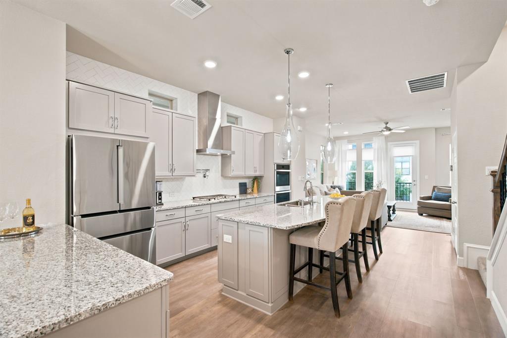 Luxury meets convenience in this turnkey David Weekley 3-story home in the heart of Trinity Groves. Ideally located minutes from Downtown Dallas, Bishop Arts, and Victory Park with easy access to major highways. This beautifully maintained 3 bedroom, 3.5 bath home features an open-concept layout filled with natural light, stylish finishes, and thoughtful upgrades throughout. The chef’s kitchen boasts a stainless steel gas cooktop, quartz countertops and a spacious island perfect for entertaining. The third-floor primary suite offers a private retreat with a sitting area, oversized garden tub, separate shower, dual vanities, and walk-in closet. All bedrooms include ensuite baths for added comfort and privacy. Enjoy stunning views from the private rooftop terrace or covered balcony, along with a 2-car rear-entry garage. Community amenities include a pool, greenspaces, and HOA-maintained yards. Ideally located just minutes from Downtown Dallas, Trinity Groves, Bishop Arts, and Victory Park, with easy access to I-30, I-35, I-45, US-75, and the Dallas North Tollway—this home is perfect for professionals, entertainers, or anyone seeking luxury living with unmatched convenience.