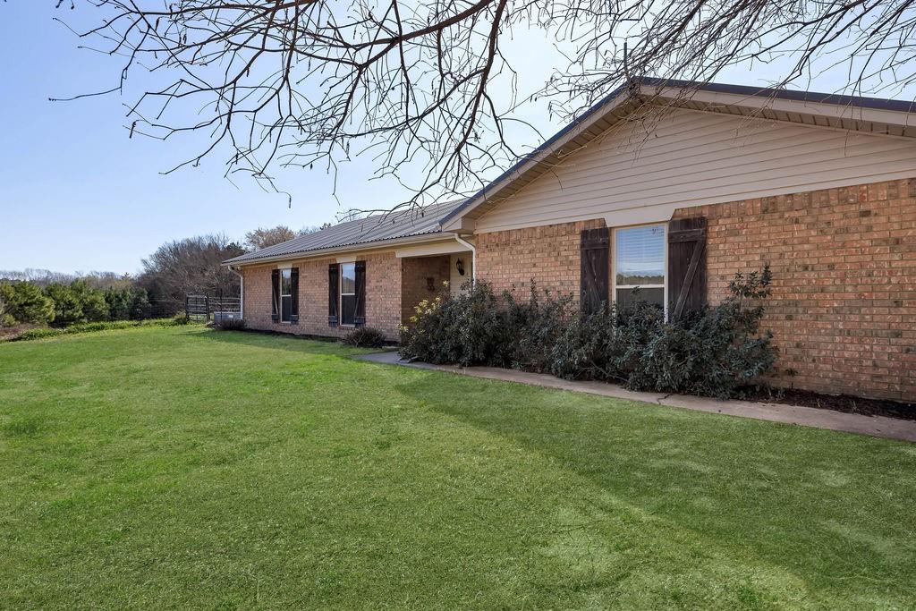 Franklin County, Winnsboro, Mt. Vernon & Lake Cypress Springs just a few minutes away with your own property's creek providing water runoff into the lake. This hilltop 3BR-2BA brick has been updated with new counter tops, SS appliances, farm sink, rolling island, pantry & large living area with brick WBFP with insert. The home has a metal roof, new paint + heat pump HVAC with Halo Air Quality System. Refrigerator, W&D are included in the sale. The home sits on 22.5 acres with 7acres of planted pine & the rest is pasture with 28x40 insulated metal building with one side lean-to with 3 stalls & a front lean-to with 3 bays for hay or other items. This metal building has a 10x28 foot concrete pad between it & the 20x28 insulated shop building has a mini split HVAC system & 10x28 covered porch. Attached in back of the shop is a 14x30 lean-to for an RV. In the same area is another 20x20 building with overhead door. Moving on is a 12x10 chicken coop, another tractor-boat 18x20 carport along with a 20x12 pipe lean to. There are 2 other lean-to shelters in the pastures along with corrals, squeeze chute, & cross fencing. The owners have a 12-08-25 appraisal for this property at $615,000. This could be the perfecthomestead for you, so come take a look.