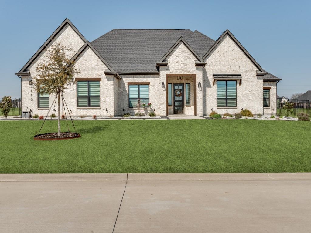 Welcome to this breathtaking single-story Terrata Home, perfectly situated on a full acre and designed with both elegance and functionality in mind. This expansive floorplan is filled with natural light and offers generous space for comfortable living and effortless entertaining.  At the heart of the home, the grand chef’s kitchen impresses with abundant cabinetry featuring accent lighting, a large center island perfect for gathering, built-in stove and oven, and exceptional storage including a huge walk-in pantry and separate butler’s pantry complete with a wine fridge. The open-concept living room boasts soaring ceilings and a stunning central fireplace that beautifully anchors the space, creating a warm and inviting atmosphere. The luxurious primary suite is a true retreat, showcasing beautiful wood beam accents and a spa-inspired bathroom with dual sinks, a soaking tub, oversized shower, and a spacious walk-in closet. Designed for both privacy and togetherness, this home also offers three additional generously sized bedrooms, a dedicated office space, and a media room—giving everyone room to spread out without feeling crowded. Step outside to your backyard oasis with an outdoor kitchen featuring a built-in BBQ grill and a large granite counter with seating—perfect for entertaining and enjoying evenings under the stars.With a full acre of land, the possibilities are endless. Add a pool, gazebo, playground, garden, or create the outdoor retreat of your dreams. 
Ideally located on a quiet road away from the rush of city life, yet conveniently close to H-E-B and just 15 minutes from restaurants and shopping. 
This exceptional property combines luxury, comfort, and space—ready to welcome you home.