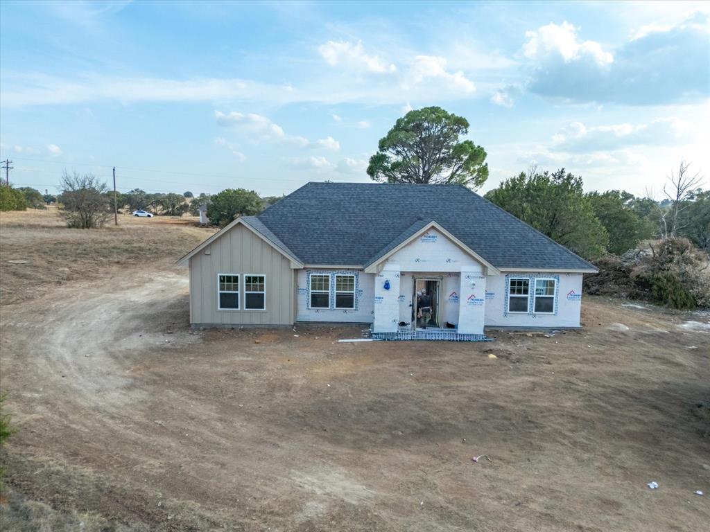 Just built new home in quiet country setting off FM 51 behind picturesque Denali Ranch! Insanely cute modern farmhouse style with board and batten and brick exterior, plus a great open design that features an oversized galley style kitchen and family room! Vaulted ceilings throughout, plus nicer finish out that includes granite in kitchen and all bathrooms and spacious walk-in closets!  Terrific lot that offers a big yard and nice views of gorgeous countryside!  A super quick commute to both Weatherford and Granbury!  Homes to include 2 car carport as well as fully fenced backyard!