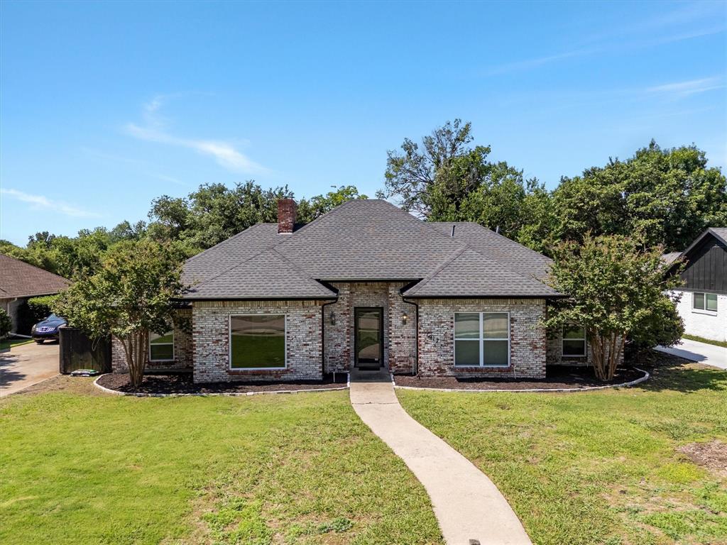 This charming brick ranch home sits on an enviable private lot backing to a neighboring creek.  This residence features a large primary suite with immediate access to the patio, as well as two separate vanities each with their own walk-in closets. The additional bedrooms are spacious, offering great natural light and their own walk-in closets. With two living areas, a fireplace, and both formal and casual dining areas, the home is perfectly suited for hosting. Additionally, the rear-entry garage provides added security and includes extra parking space.