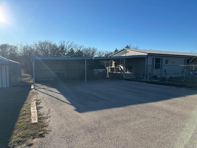 Rare opportunity on over 2 acres — updated, well-maintained manufactured home with flexible living and abundant outbuildings. This property features a detached garage and dedicated shop, a large storage shed, and a rentable ADU for additional income or guest space. Recent updates throughout the main home provide modern comfort while maintaining easy-care living. Expansive outdoor space offers privacy, room for hobbies or animals, and ample parking. Convenient to local schools, shopping and major routes. Don't miss this versatile property with exceptional storage and income potential.