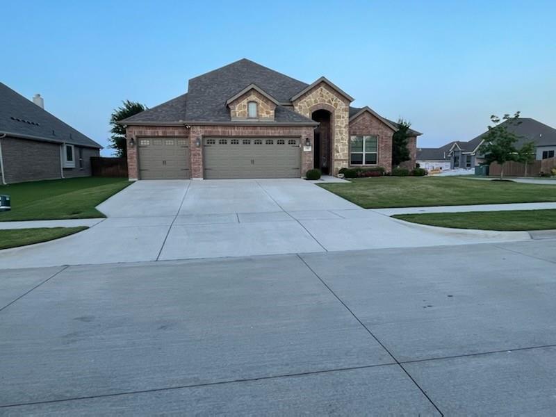 A MUST SEE! Welcome to this exceptional JOHN HOUSTON CUSTOM HOME located in the highly sought-after North Grove community of Waxahachie. Situated on a premium oversized corner lot, this beautifully designed 4-bedroom, 3-bath home offers the perfect blend of luxury, comfort, and functionality, complete with a private office that can easily serve as a 5th bedroom.  

From the moment you step inside, you’ll be captivated by soaring vaulted ceilings, rich wood flooring, abundant natural light, and a stunning fireplace that anchors the spacious open-concept living area. The chef-inspired kitchen features a large island, generous cabinetry, and seamless flow into the dining and living spaces, making it ideal for both everyday living and entertaining.

The thoughtfully designed floor plan includes a formal dining room, dedicated office, and a spacious 3-car garage with extensive attic storage. Recent updates include a brand-new roof, providing peace of mind for years to come.

Step outside and enjoy beautifully landscaped front and back yards, a covered patio, charming garden shed, and a serene backyard retreat where the gentle Texas breeze creates the perfect setting for morning coffee or evening relaxation.

This home is vacant, move-in ready, and waiting for its new owners. Residents of North Grove enjoy outstanding neighborhood amenities, including a olympic size pool, playground, walking trails, and beautifully maintained common areas. Conveniently located near top-rated schools, lots of shopping, dining, and major highways, this home offers the perfect combination of small-town charm and modern convenience.

Kick off your shoes and stay awhile—because this isn’t just a house, it’s home.