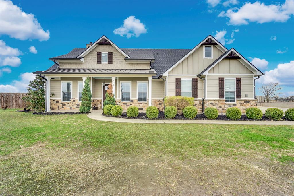 $1,000 Buyer's Concession for executed contract by June 30th. Welcome to 12.645 acres of Texas paradise.Just off the beaten path yet just minutes from the charm and amenities of Waxahachie, this exceptional property offers the perfect balance of privacy, space, and accessibility for city amenities.  Behind a gated entry, a true country oasis surrounded by other beautiful farm and ranch properties. The acreage is fenced and cross-fenced, making it ideal for cattle or horses, and includes a 2-stall loafing shed with 12x12 feed and tack storage, along with fruit trees that add to the charm and functionality of the land.  The home itself was the builder’s personal residence, showcasing thoughtful craftsmanship and custom touches throughout. Step inside to soaring ceilings with warm wood finishes that create a stunning sense of space. The living room centers around a hand-crafted stone fireplace, flanked by custom cabinetry, creating a striking focal point and an inviting place to gather. The spacious kitchen is designed for both beauty and function, featuring a huge island, beautiful light fixtures, and a generous walk-in pantry that offers exceptional storage. Downstairs you’ll find three bedrooms and 2.5 baths, providing comfortable and practical living space. Upstairs offers a versatile retreat that could serve as a media- game room, office, or private guest suite. Complete with a wet bar and a private balcony, it’s the perfect place to unwind and enjoy peaceful mornings while overlooking your property. Step outside to the massive back patio, an entertainer’s dream and the perfect place to host family and friends while taking in sweeping views of your land and the surrounding countryside. This property truly offers the best of both worlds—a tranquil country lifestyle with a “wide-open Texas” feel, yet close to the conveniences of town.