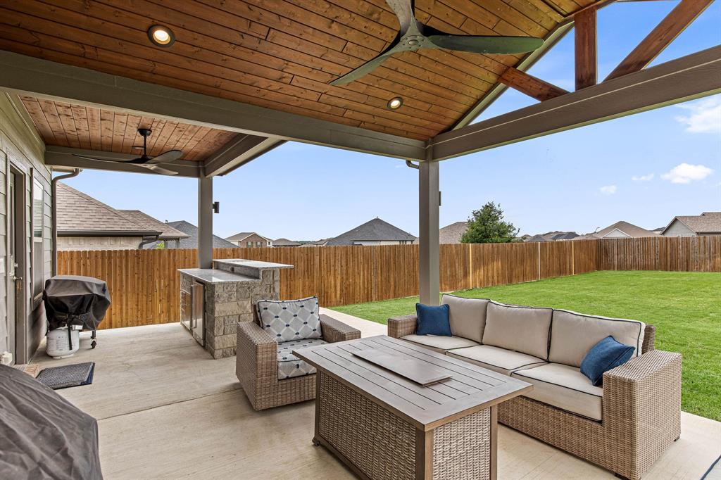 Thoughtfully priced and ready for its next owner, this Cibolo Hills home stands apart with a fully upgraded backyard designed for elevated Texas entertaining from day one.

A spacious attached covered patio with ceiling fans extends into a thoughtfully designed outdoor kitchen complete with a beverage cooler, storage drawers, and built-in trash, creating a turnkey outdoor living space ready for gatherings, grilling, and game days without additional investment.

Inside, the home offers over 3,000 sq ft with 5 bedrooms, 3 bathrooms, two living areas, and an open-concept layout centered around a modern kitchen with quartz countertops, designed for both everyday living and effortless entertaining.

What truly enhances this home is its energy-efficient construction and systems. Spray foam insulation, tankless water heater, Energy Star appliances, double-pane Low-E windows, programmable thermostat, enhanced air filtration, and smart irrigation controls all work together to improve comfort while helping reduce utility costs.

Situated on one of the larger lots in the community, there is still ample space to add a pool or further customize the outdoor living experience.

Residents of Cibolo Hills enjoy resort-style amenities including a community pool, playgrounds, jogging and bike trails, and a community center. Zoned to Eagle Mountain High School, with a future on-site elementary school planned.

A rare combination of upgraded outdoor living, energy efficiency, and space in one of the area’s most desirable communities.