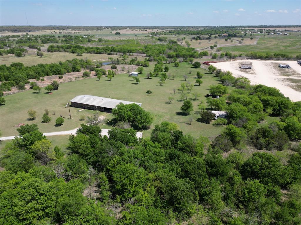 Welcome to your private Texas retreat on 26+ acres at 2101 Ridge View Drive in Cleburne. Tucked behind a gated entrance, this property offers the perfect blend of space, functionality, and peaceful country living—just a short drive from town.
As you enter, you’re greeted by wide-open land, mature trees, and endless possibilities. Whether you're looking for a homestead, ranch setup, or a place to run a business from home, this property is built to accommodate.
The land is the true highlight—26+ acres of usable space ideal for livestock, recreation, or future expansion. With plenty of room to roam, you’ll enjoy privacy, scenic views, and that hard-to-find freedom that’s becoming increasingly rare in North Texas.
For those needing workspace or storage, the property features two large shops along with additional outbuildings, providing flexibility for equipment, hobbies, or business operations. Whether you're a contractor, car enthusiast, or simply need extra room, this setup delivers.
The gated entry adds an extra layer of security and exclusivity, making this property feel like your own secluded estate.
Opportunities like this don’t come often—acreage, functionality, and privacy all in one. Come experience the potential and lifestyle this property has to offer.