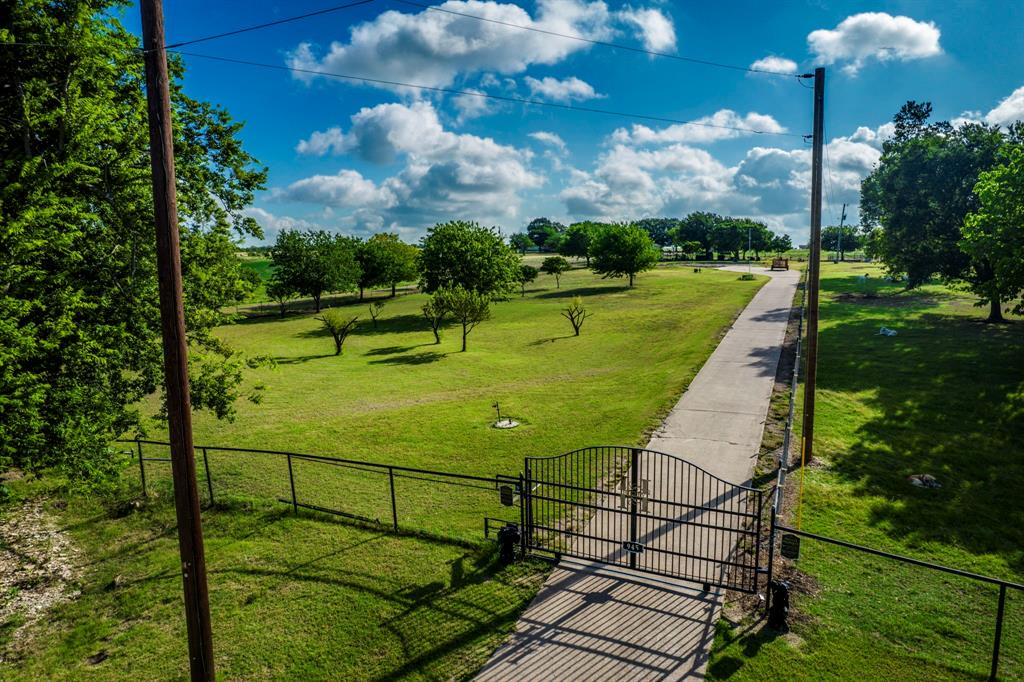Bring your dreams and house plans to this exceptional 4-acre improved property ready for your custom home! Located outside the city limits, this beautiful tract offers the perfect blend of country living and convenience. Already equipped with water, electricity, and an existing septic system, much of the hard work has already been done. A cleared pad site is ready for construction, allowing you to start building sooner. The property is gated and cross-fenced, making it ideal for livestock or hobby farming, and includes a storage building and 3-sided goat barn for all your equipment and projects. Whether you're dreaming of a peaceful country retreat, a small homestead, or the perfect place to build your forever home, this property offers endless possibilities. Enjoy the privacy of rural living while still being within easy reach of nearby amenities of Waxahachie. Don't miss this rare opportunity to create the lifestyle you've always wanted!