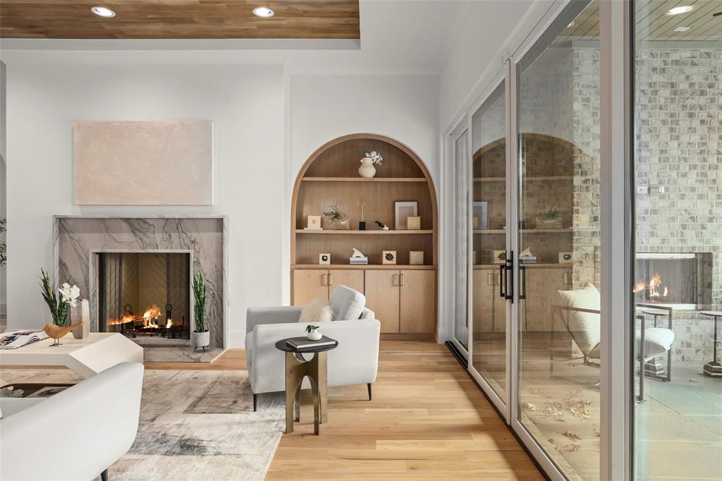Located on one of the BEST blocks in Midway Hollow.  This meticulously designed 5-bedroom, 5.1-bath residence was thoughtfully created by renowned builder Olerio Homes. This custom home exudes a soft contemporary feel, featuring solid oak wood flooring, smooth wall finishes, designer lighting and custom white oak cabinetry throughout. Entertain effortlessly in the expansive kitchen, living, and dining areas. The chef’s kitchen impresses with high end appliances, and a walk-in pantry for seamless organization. The primary suite offers a serene retreat with luxurious details, a free standing tub and a custom closet. Upstairs, an oversized game room with a built-in bar and four additional en suite bedrooms. Step outside to spacious backyard complete with a covered patio with motorized shades and a gas fireplace. This one was crafted for those who appreciate the finest in modern living.