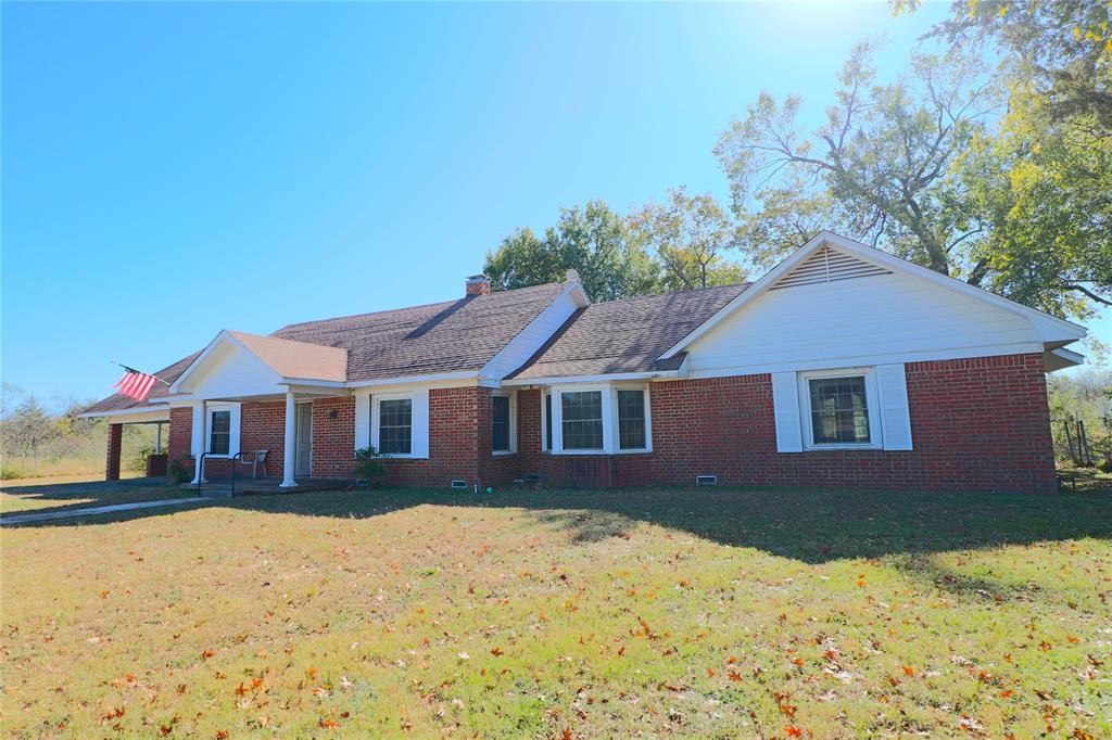 Step into this 2,124 sq. ft. brick home full of character and potential! Featuring 3 bedrooms, 2 bathrooms, and two spacious living areas—each with its own cozy fireplace, this home offers a warm and inviting layout ready for your personal touch. The formal dining room and exposed brick accents throughout add timeless charm. Nestled just outside of town for ultimate privacy and a taste of country living, this property sits on a large 0.5-acre lot with a circle drive and 2-car carport. The sellers are offering an incredible $60,000 in seller concessions to help with your desired updates and renovations—making this the perfect opportunity to create your dream home. Bring your vision and make this one-of-a-kind property your own!