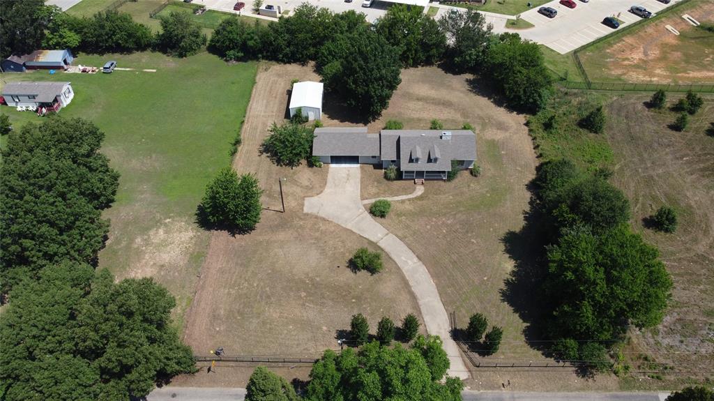 Over an acre, in town!  Come cit in the center of Athens, TX with over 1.25acres of land to maintain privacy.  This location is a great investment at an incredible value.  The home is ready for its new family to enjoy.  Don't let the 2 bedrooms stop you as this house is over 2300 square feet of functional space.  One of the largest utility rooms you have ever seen.  An attached 2-car carport with a metal shop in the back.  Schedule a showing today to discover the true possibilities this property can be for you!