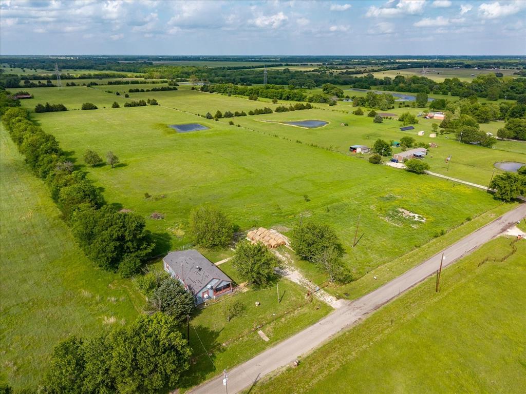 This beautiful 31+ acre property is an ideal location to build your new home. Country privacy and close to city conviences. An old home located on the property with some TLC could provide a weekend hideaway or housing while your new home is built. A barn is located toward the rear of the property. 1 large pond and 1 smaller pond provide water and both are stocked with fish,and deer roam the meadows. The county road along the front of the property serves as access to State Highway 69 on the west and Highway 34 on the east. Come take a look.